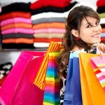 girl shopping and carrying bags in a retail store